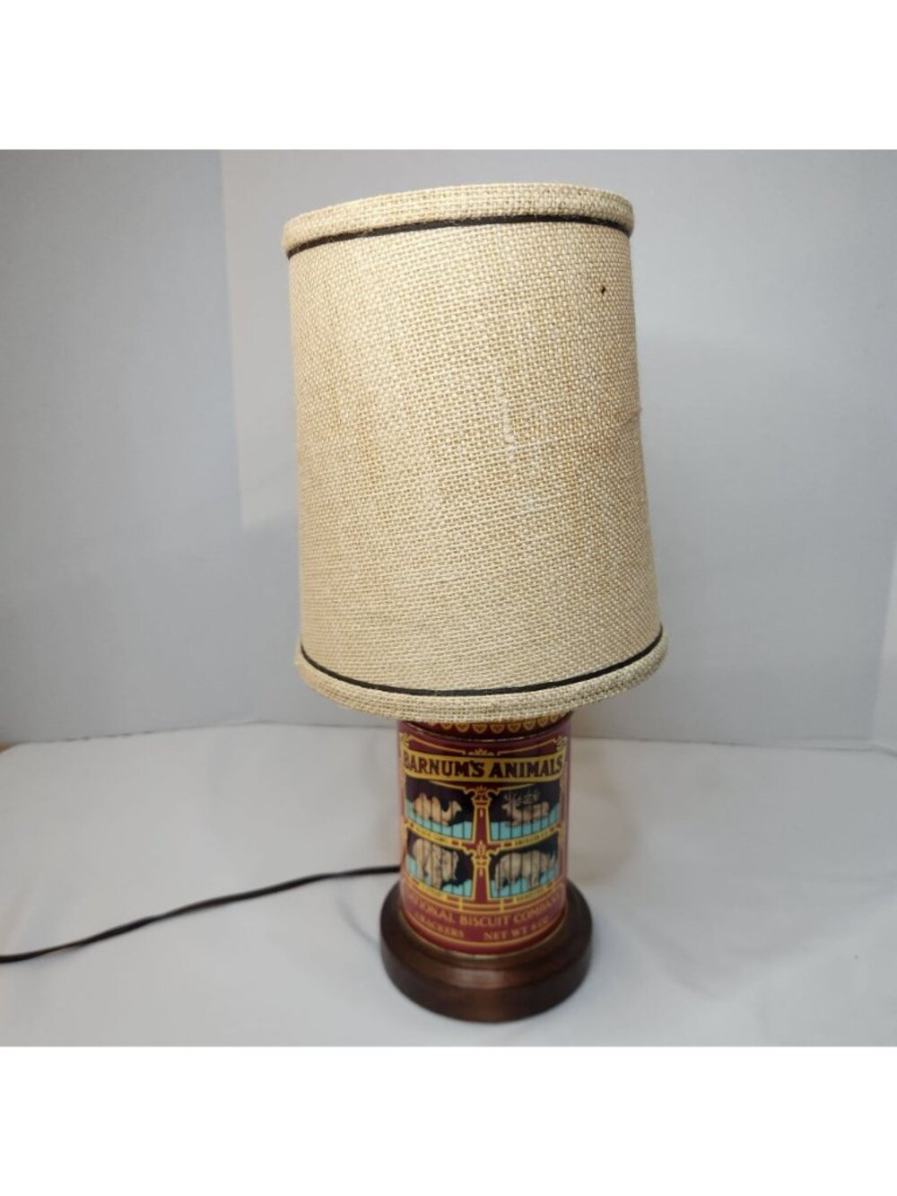 Barnums Animals Cracker Tin Table Lamp With Burlap Shade & Wood Base